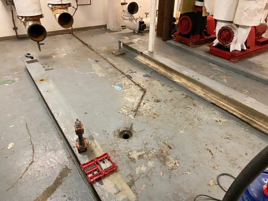 Prepped floor concrete slab before repairs